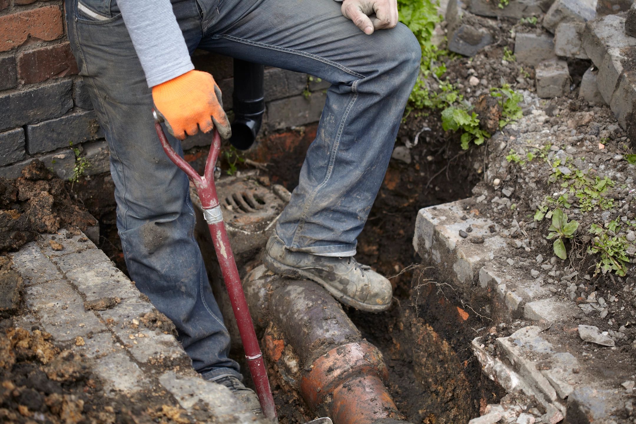 Worker conducting drain removal services in Joliet, IL